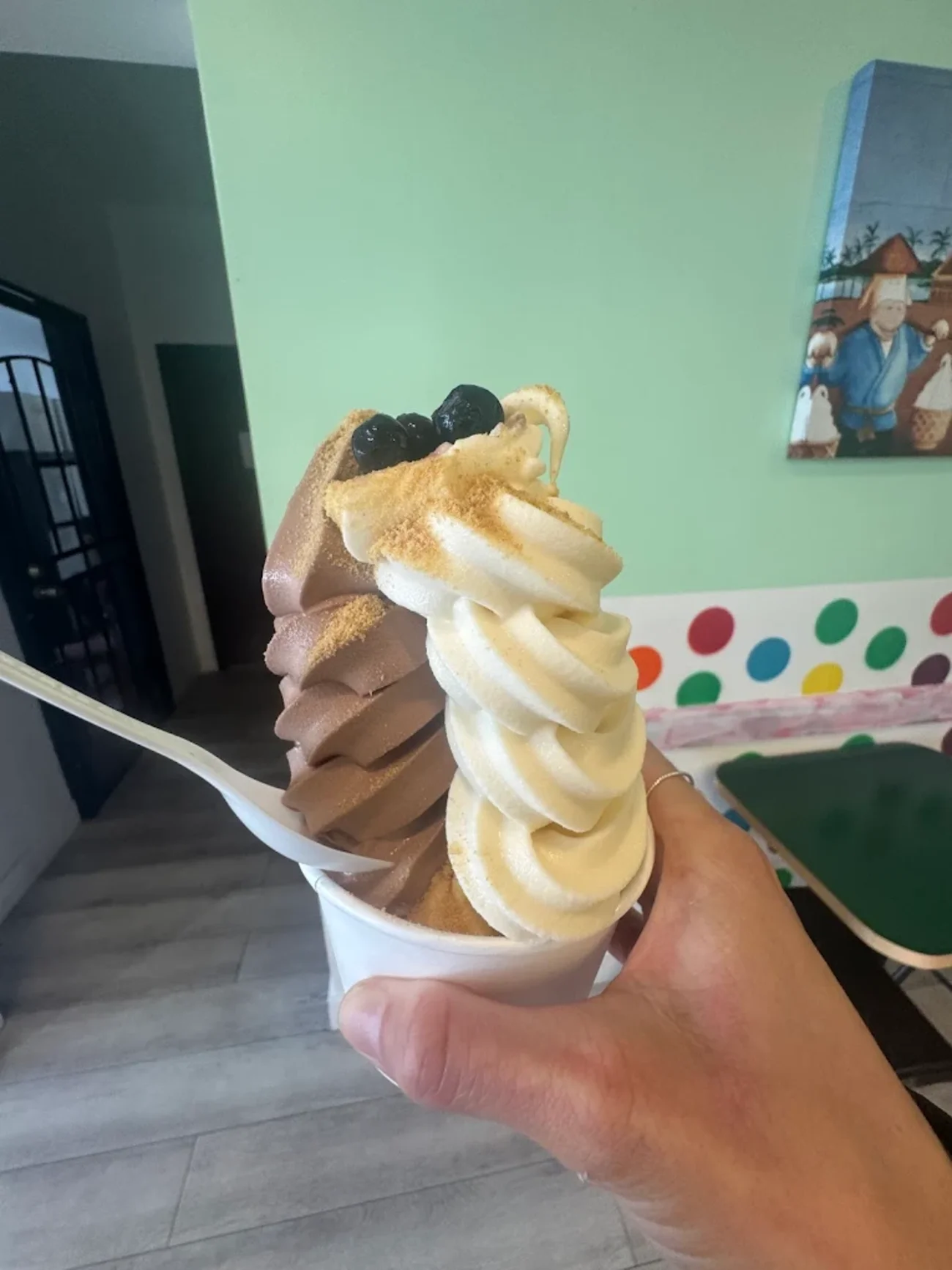 A graham-dusted vanilla and chocolate swirl cone at Rockie's