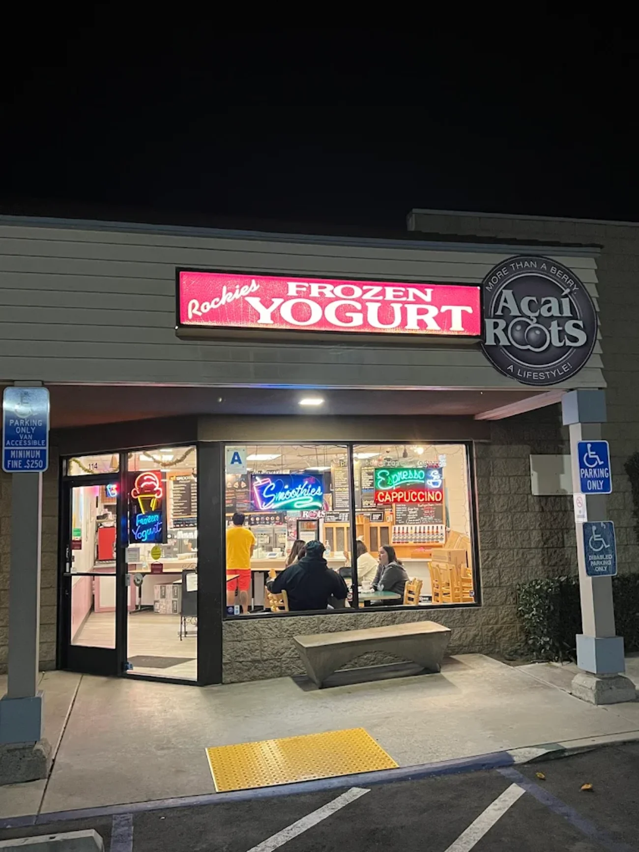 Rockie's Frozen Yogurt storefront glowing at night in San Diego